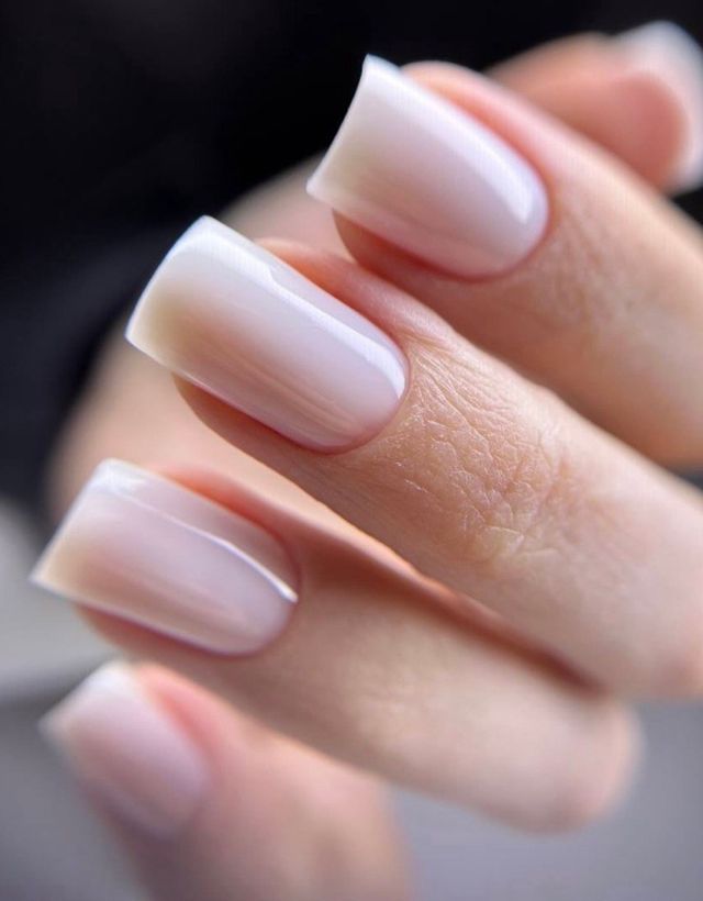 Long square nails in a milky white babyboomer gradient